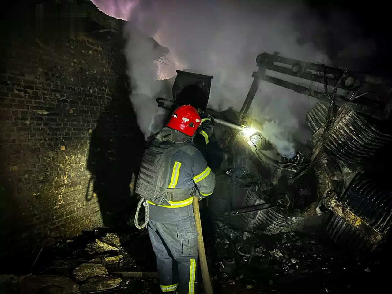 A firefighter at a site hit by a Russian attack in Odesa region (March 2026)